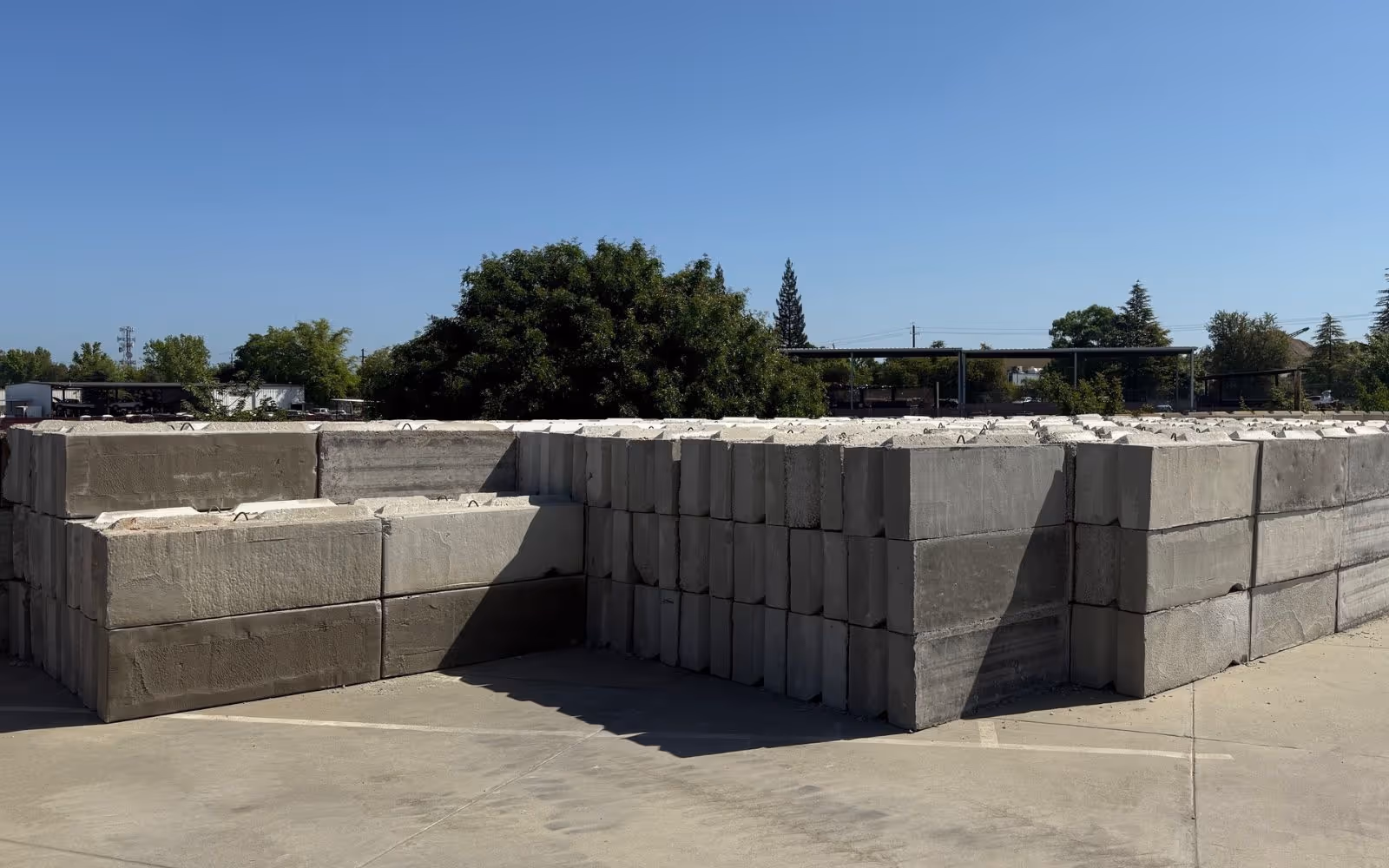 Row of interlocking concrete blocks forming a barrier