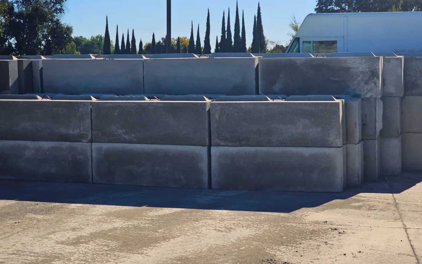 Interlocking concrete blocks stacked into aggregate material bins