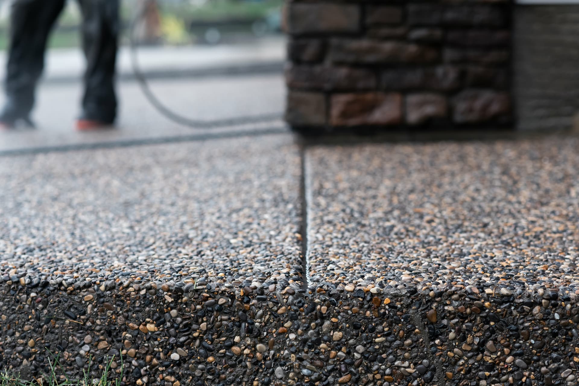 Exposed aggregate concrete surface with visible stones